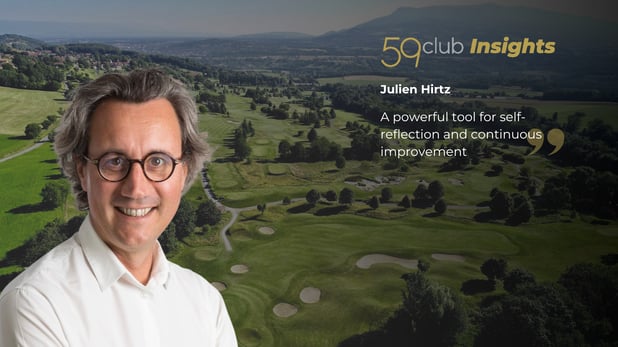A man with glasses with a golf course background